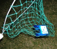 Photograph of floppy disk caught in a net